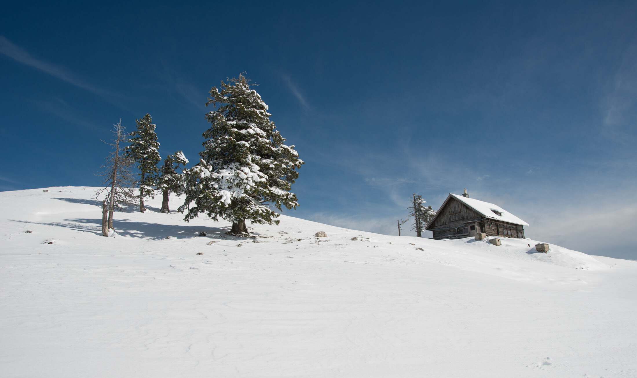 Mountain hut in snow